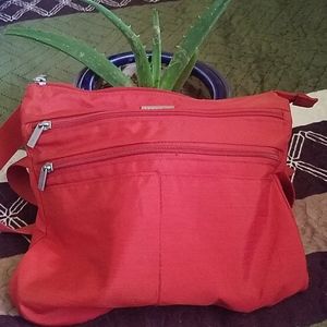Cross body orange baggallini bag